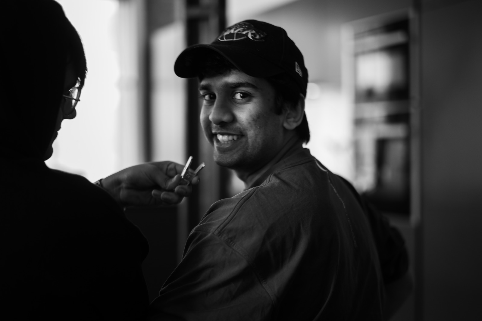Krish Pinto on set, being clipped with a radio mic between setups.